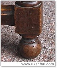 Woodworm holes in a chair leg - Photo  Copyright 2002 Gary Bradley